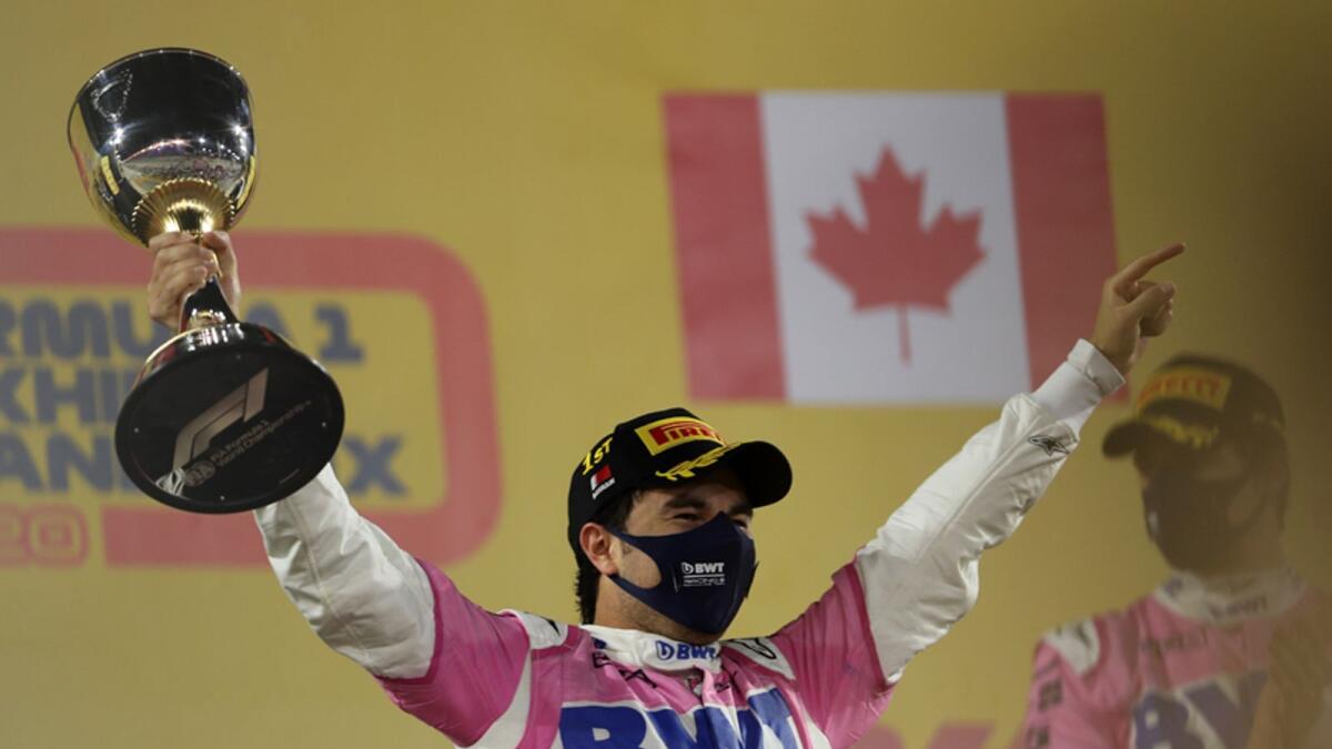 Racing Point's Sergio Perez celebrates on the podium with the trophy after winning the Sakhir GP on Sunday. — Reuters