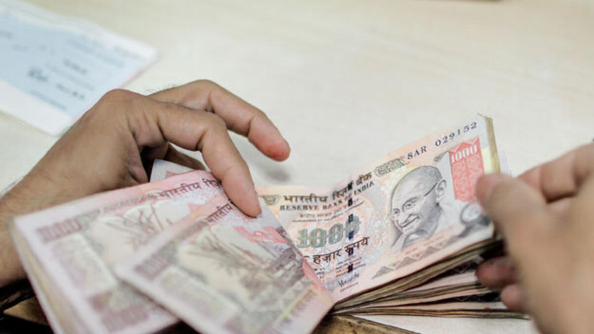 Rupee rises to 10-month high of 58.61 against dollar