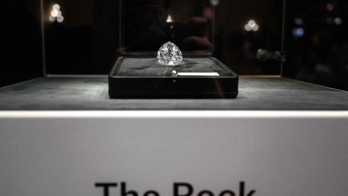 The Rock, the biggest white diamond ever pictured prior to the start of Christie's Magnificent Jewels sales in Geneva. – AFP