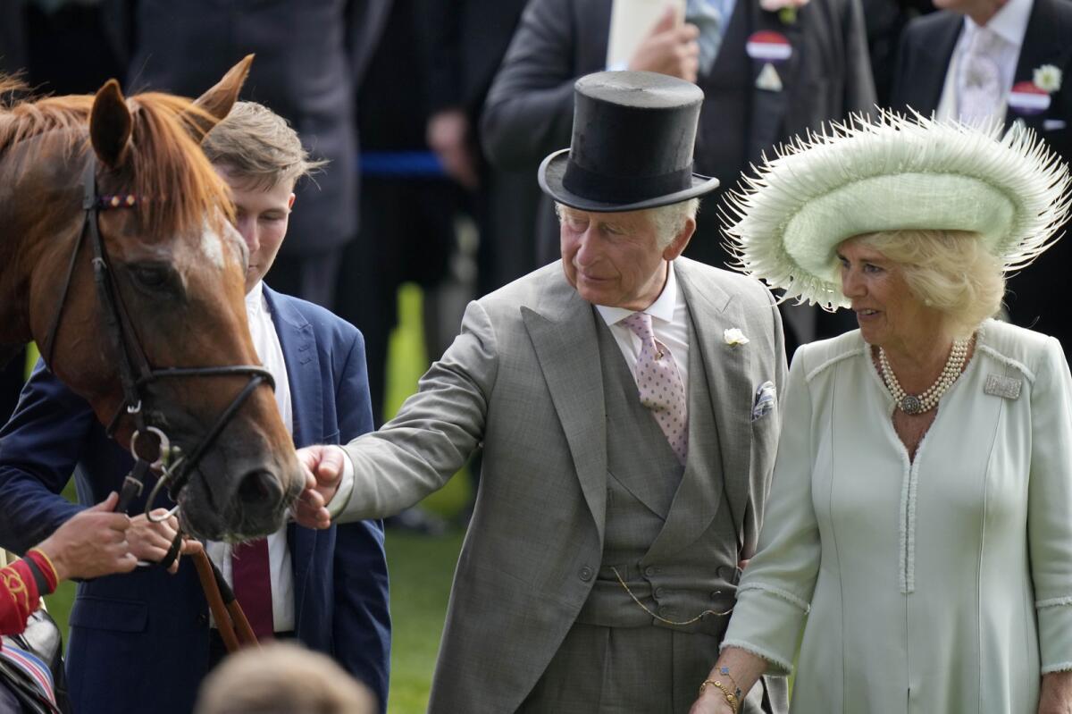 King Charles III and Queen Camilla with Desert Hero at Royal Ascot. - AP