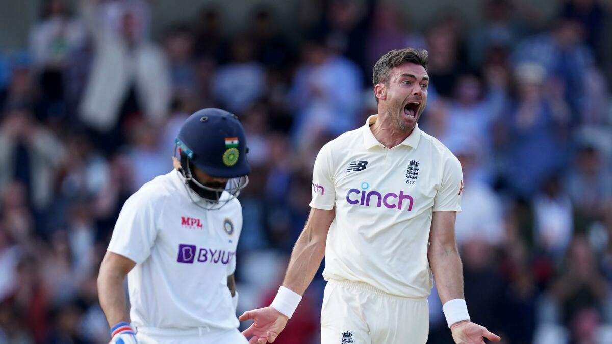 England's James Anderson (right) celebrates the wicket of Indian captain Virat Kohli. (AP)