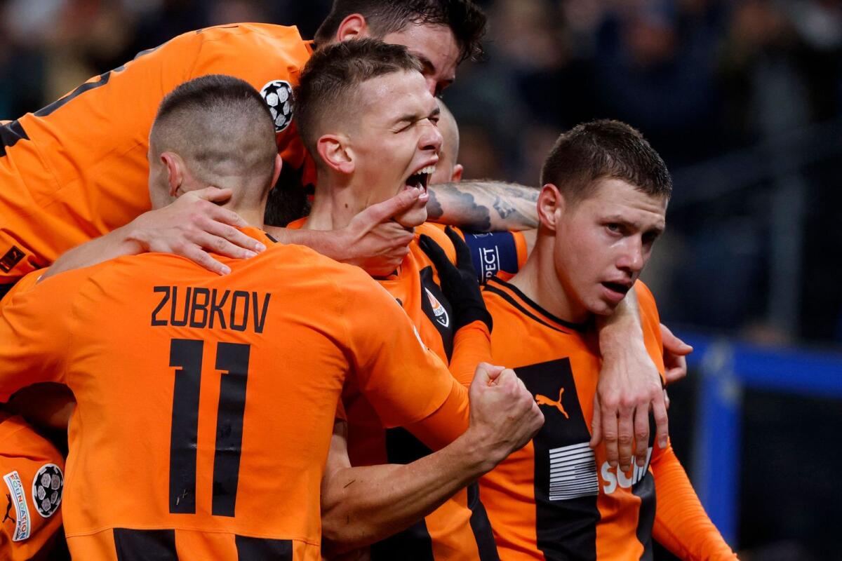 Shakhtar Donetsk's players celebrate the opening goal by Danylo Sikan. — AFP