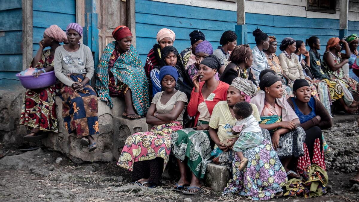 Residents displaced by the Mount Nyiragongo volcanic eruption wait to register to receive some aid. Photo: AFP