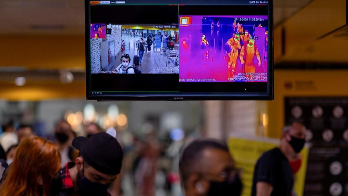A screen showing thermal scanning to check the temperature of passengers at the Guarulhos airport, is seen amid concerns about the spread of the coronavirus disease (COVID-19), in Guarulhos, Sao Paulo state, Brazil, December 27, 2020.