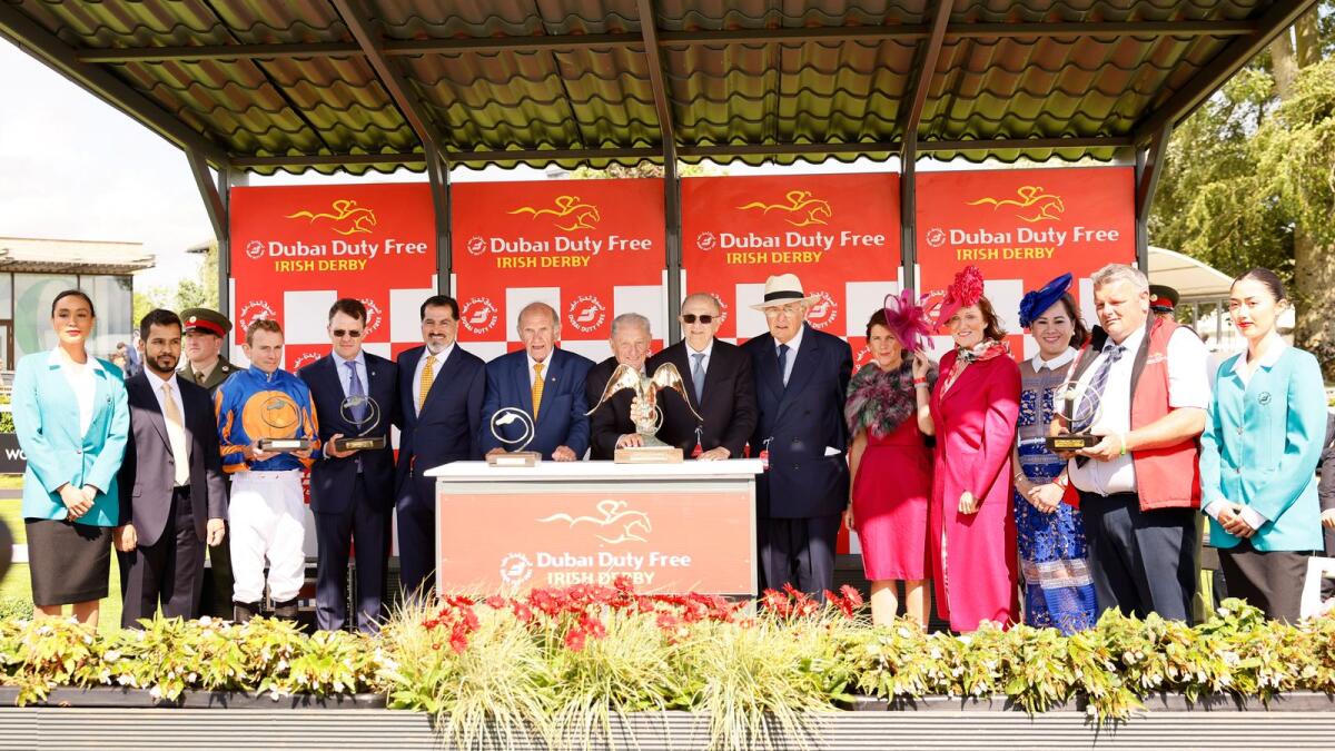Colm McLoughlin, Salah Tahlak and Sinead El Sibai along with Alison Milton, Ambassador of Ireland to the UAE, presenting the trophies to the winning connections of Coolmore Stud owners; Michael Tabor, John Magnier and Derrick Smith, trainer Aidan O’Brien and jockey Ryan Moore after ‘Auguste Rodin’ won the 2023 Dubai Duty Free Irish Derby. Also, in the photo is Jasmin Micoyco, Manager - Projects &amp; Events, and ‘Auguste Rodin’s groom David Hickey.