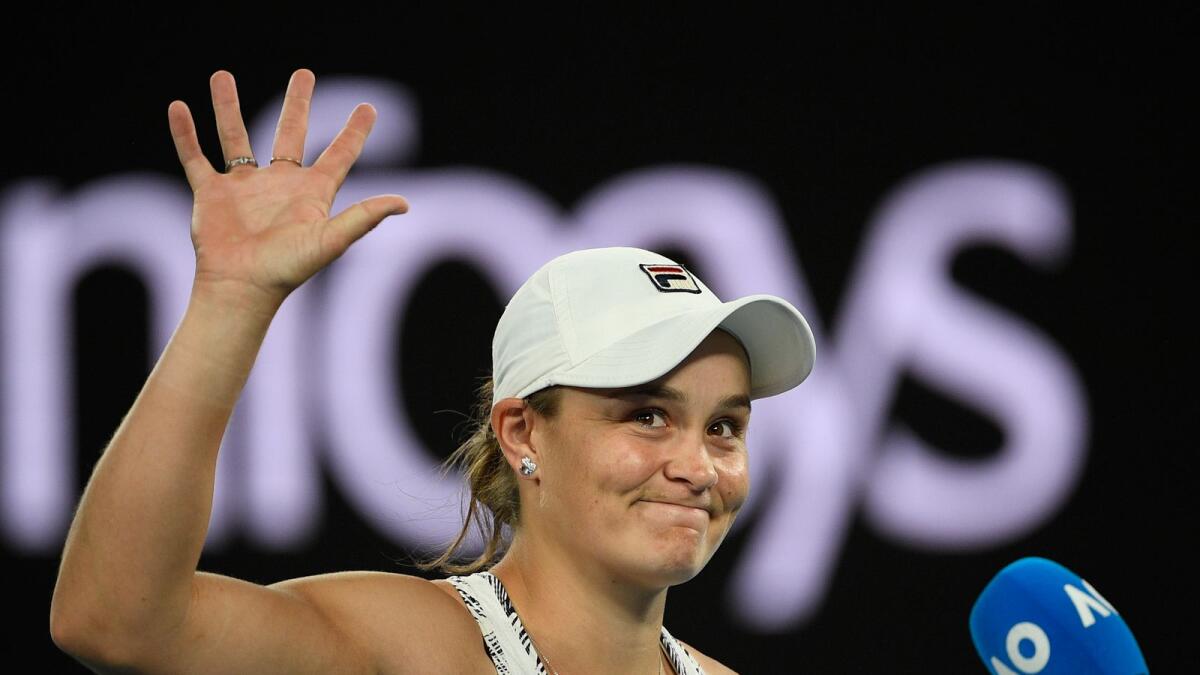 Ash Barty of Australia waves during an on-court interview after defeating Camila Giorgi of Italy. (AP)
