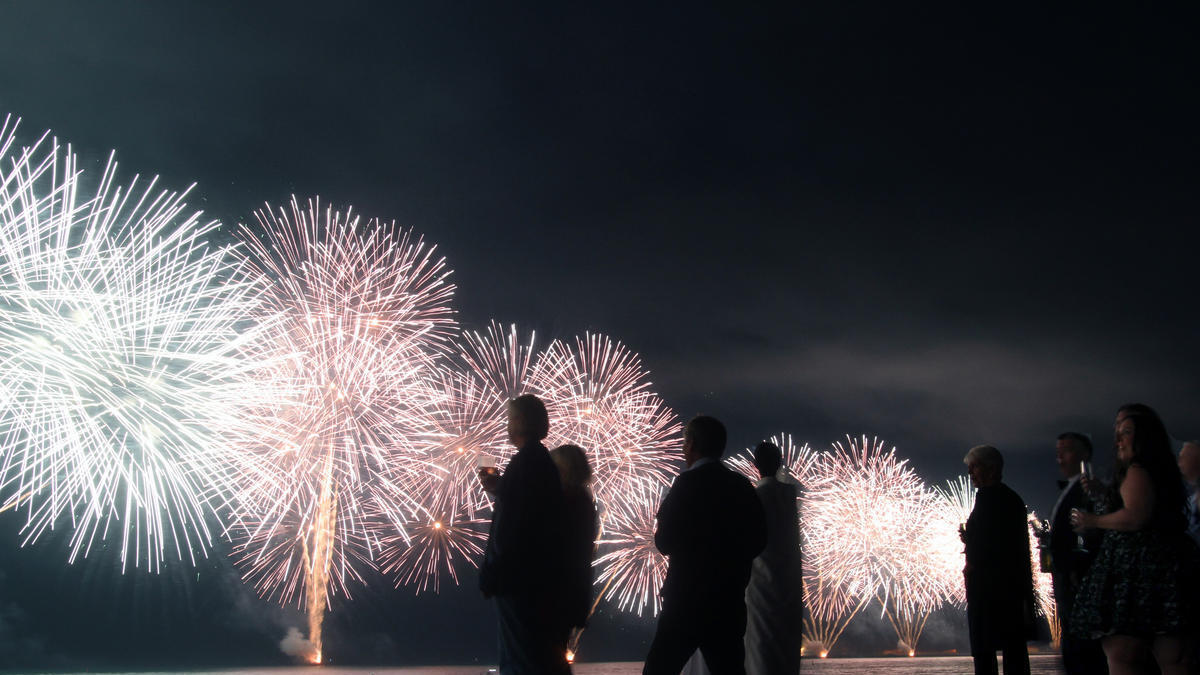 Residents enjoy fireworks at a beach in UAE