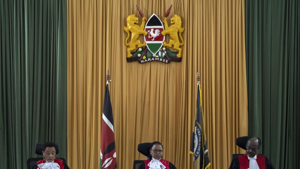 From left to right, Kenya's Supreme Court judges Deputy Chief Justice Philomena Mbete Mwilu, Chief Justice Martha Koome, and Mohammed Khadhar Ibrahim, deliver judgement in the electoral petition at the Supreme Court in Nairobi, Kenya Monday, Sept. 5, 2022. Photo: AP