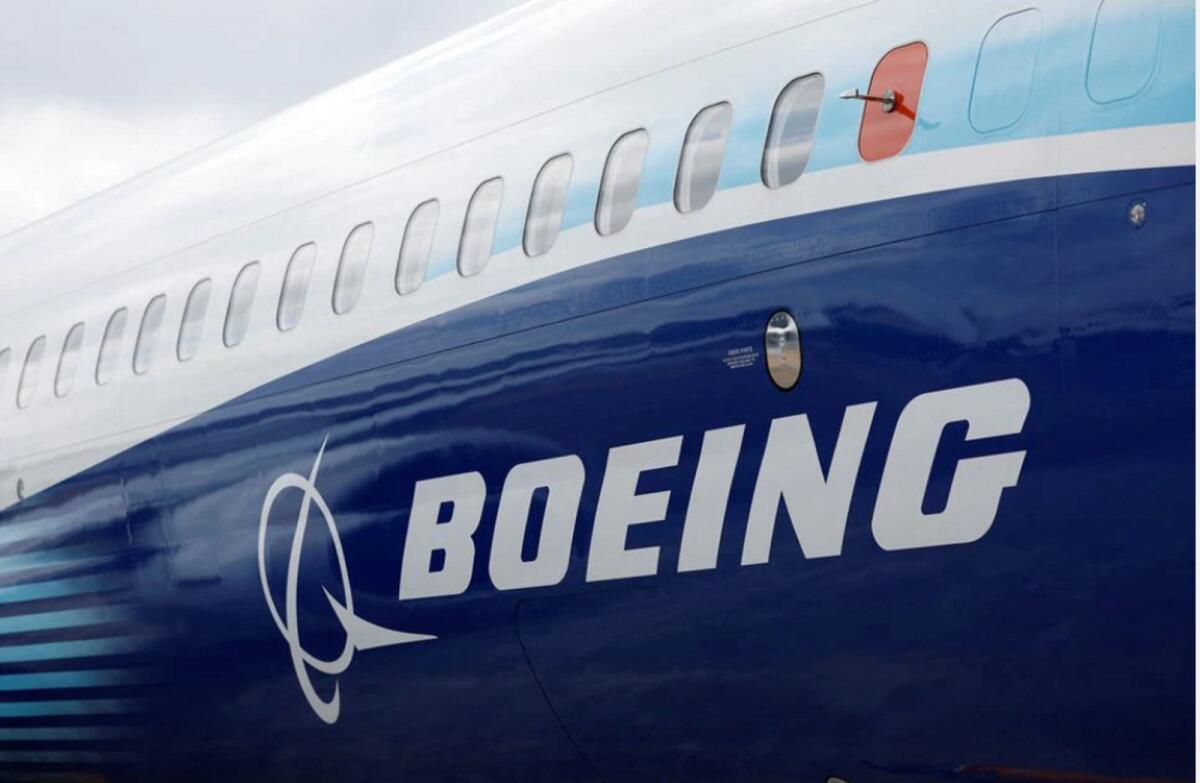 The Boeing logo is seen on the side of a Boeing 737 MAX at the Farnborough International Airshow, in Farnborough, Britain, July 20, 2022. Photo: AFP