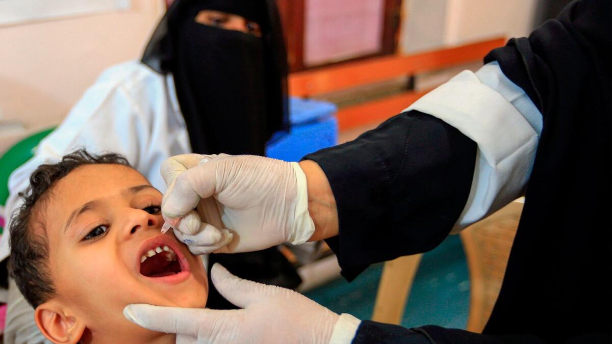 A Yemeni child receives a polio vaccination during an immunisation campaign at a health clinic in the capital Sanaa on November 28, 2020.