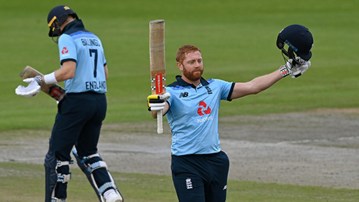 England's Jonny Bairstow celebrates after scoring his century during the ODI cricket match against Australia at Old Trafford on Wednesday. -- AFP