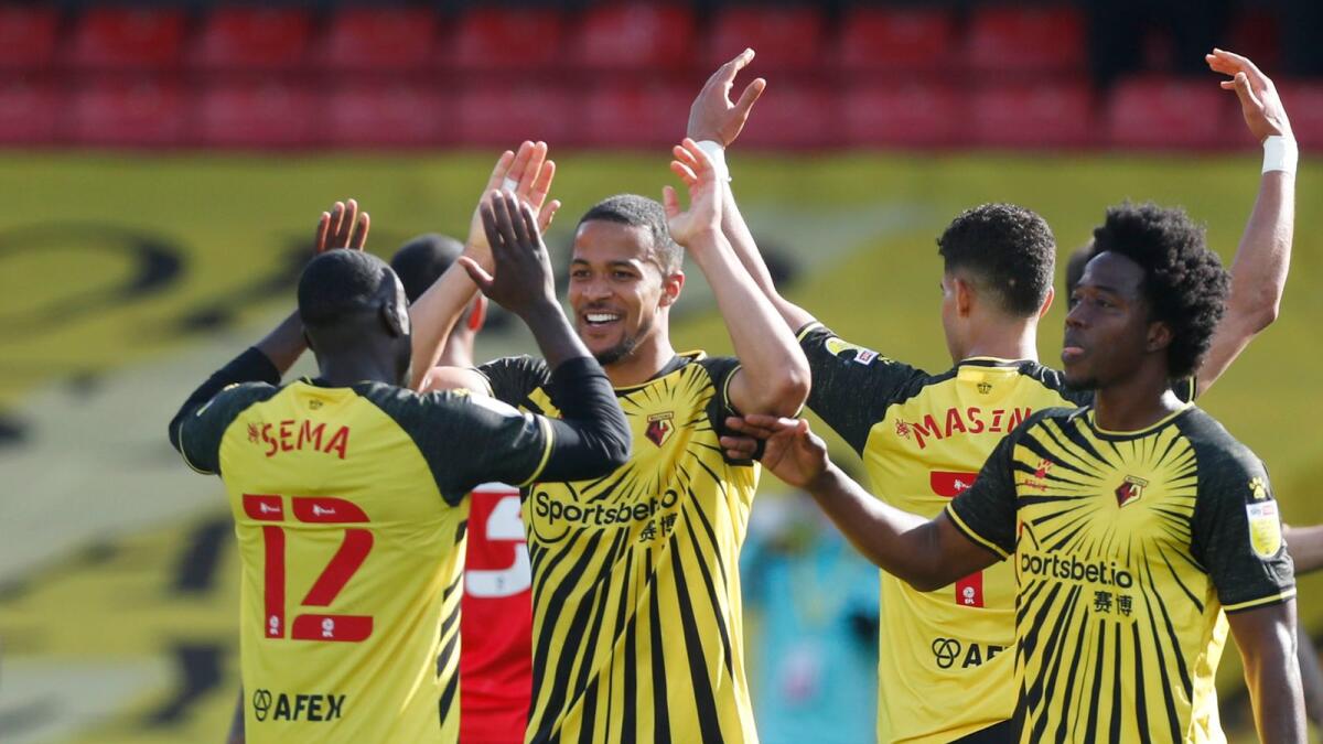 Watford's William Troost-Ekong and Ken Sema celebrate promotion to the Premier Leagu. — Reuters