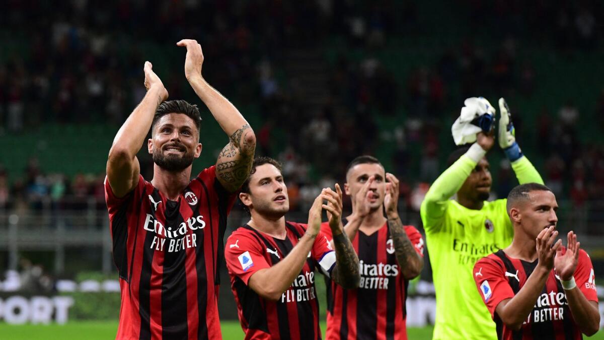 AC Milan players celebrate their win over Cagliari. (AFP)
