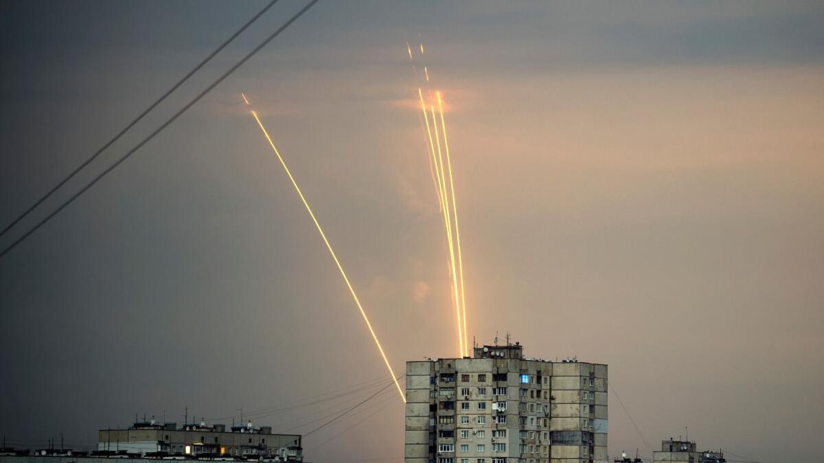 Russian rockets launch against Ukraine from Russia's Belgorod region are seen at dawn in Kharkiv, Ukraine, Monday, August 15, 2022. (AP Photo/Vadim Belikov)