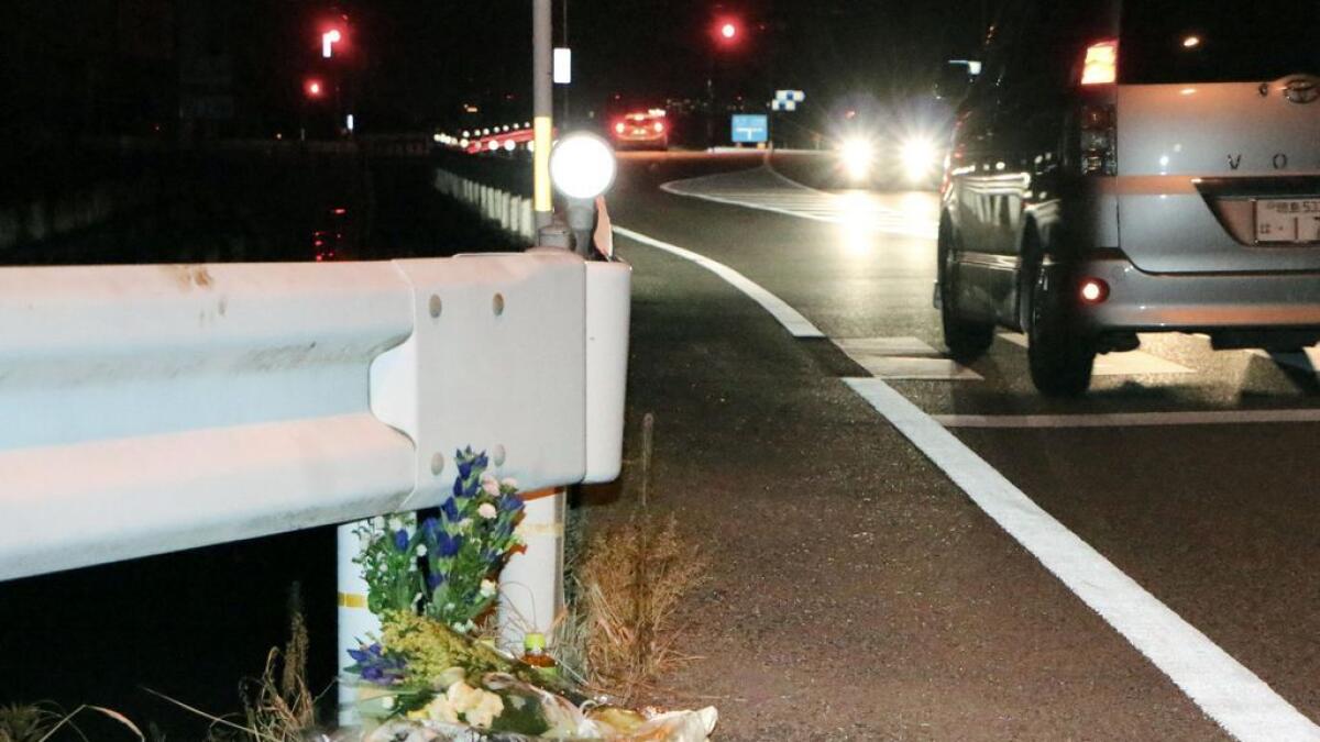 Flowers are laid near the scene where a passer-by was killed after being hit by a driver playing 'Pokemon Go' while driving in Tokushima, Japan