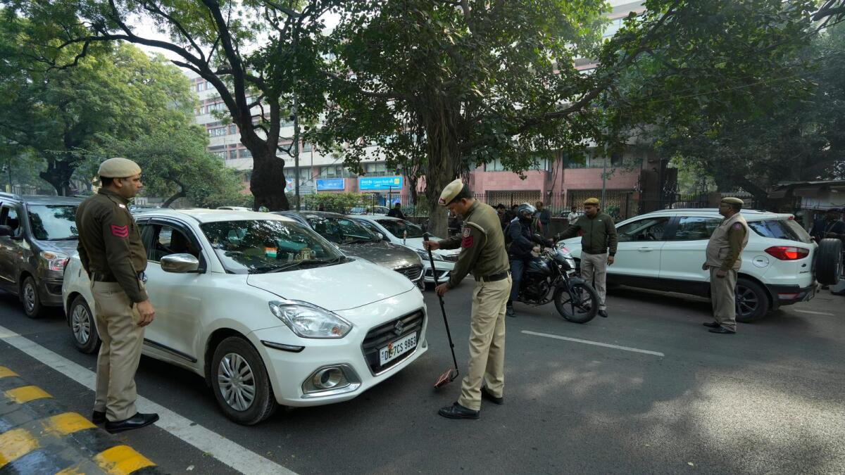 Security personnel check a vehicle near the Parliament House in New Delhi on Thursday. Photo: PTI