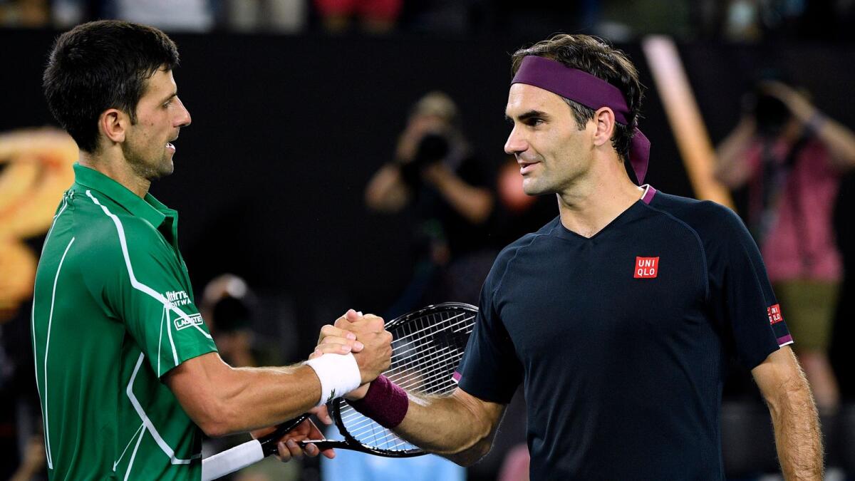 Roger Federer (right) and Novak Djokovic. — AP file