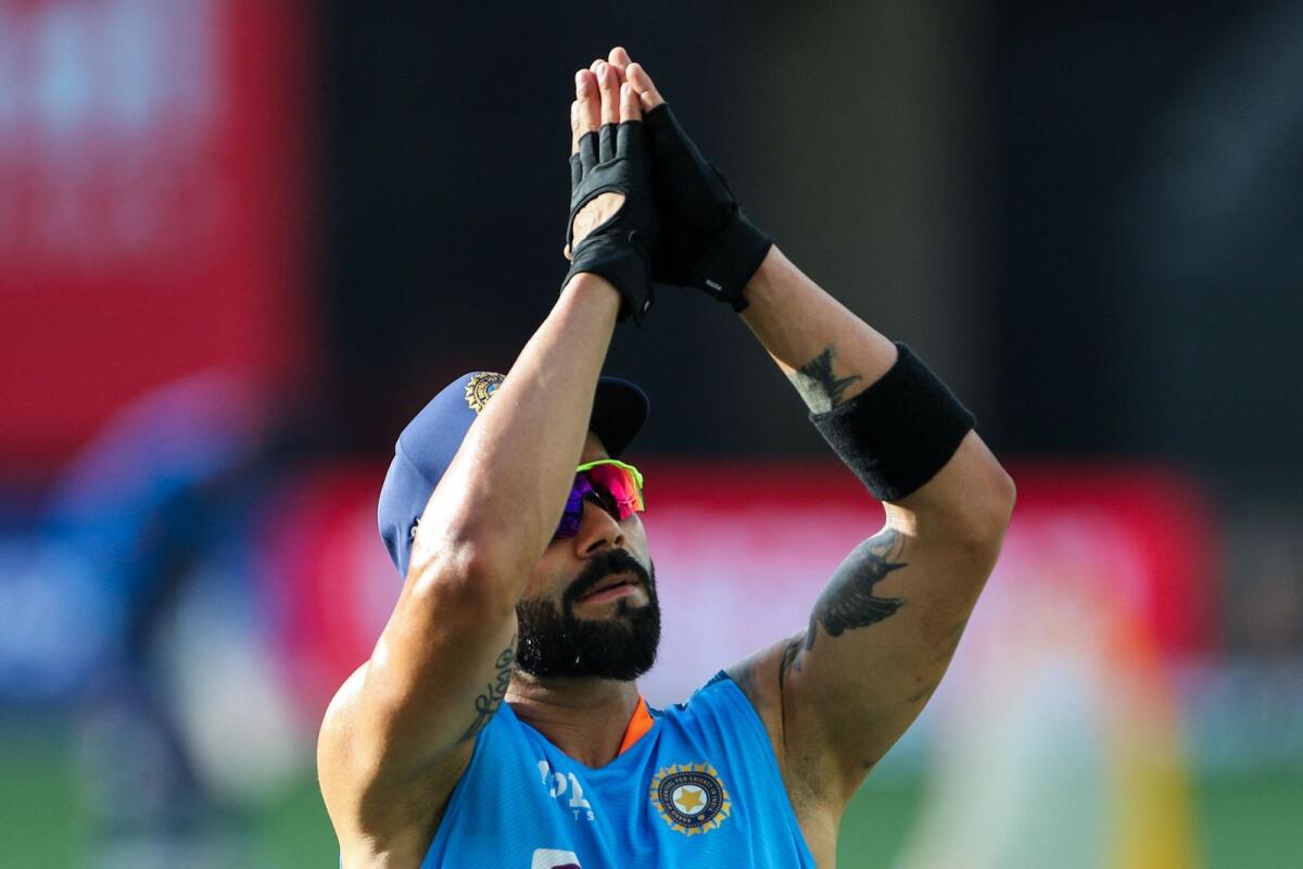 India's Virat Kohli warms up before the start of the Asia Cup match against Hong Kong. (AFP)