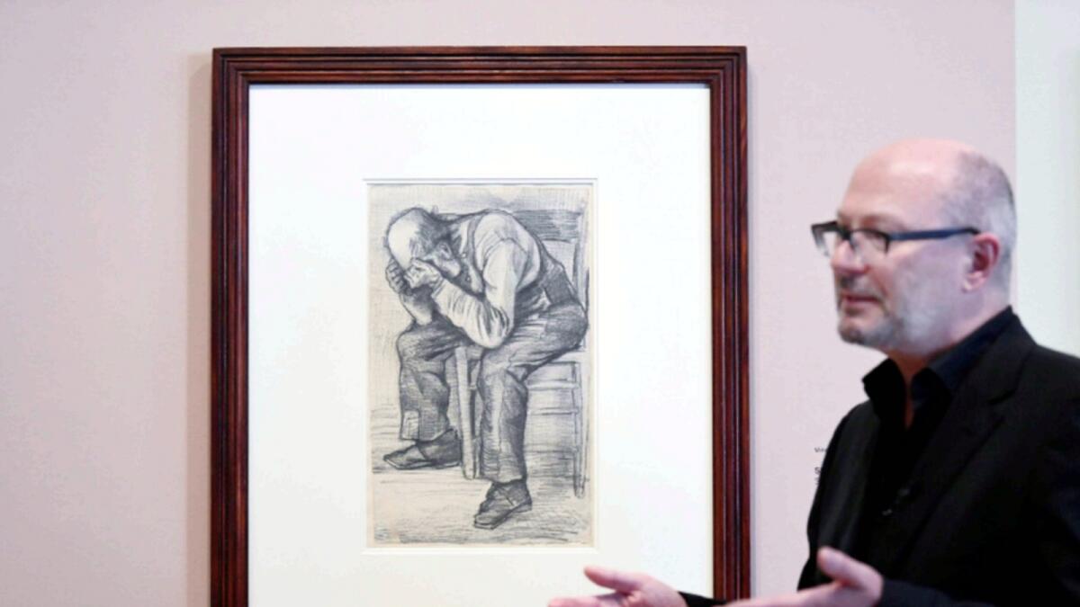 Senior researcher Teio Meenendorp unveils an unseen artwork by Vincent van Gogh that is named 'Worn Out' at The Van Gogh Museum in Amsterdam. — Reuters