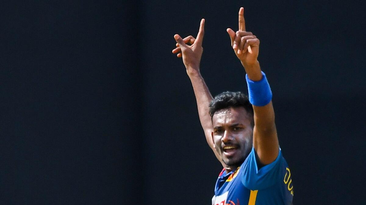 Dushmantha Chameera celebrates after taking the wicket of Australia's David Warner during the third one-day international on June 19. (AFP)