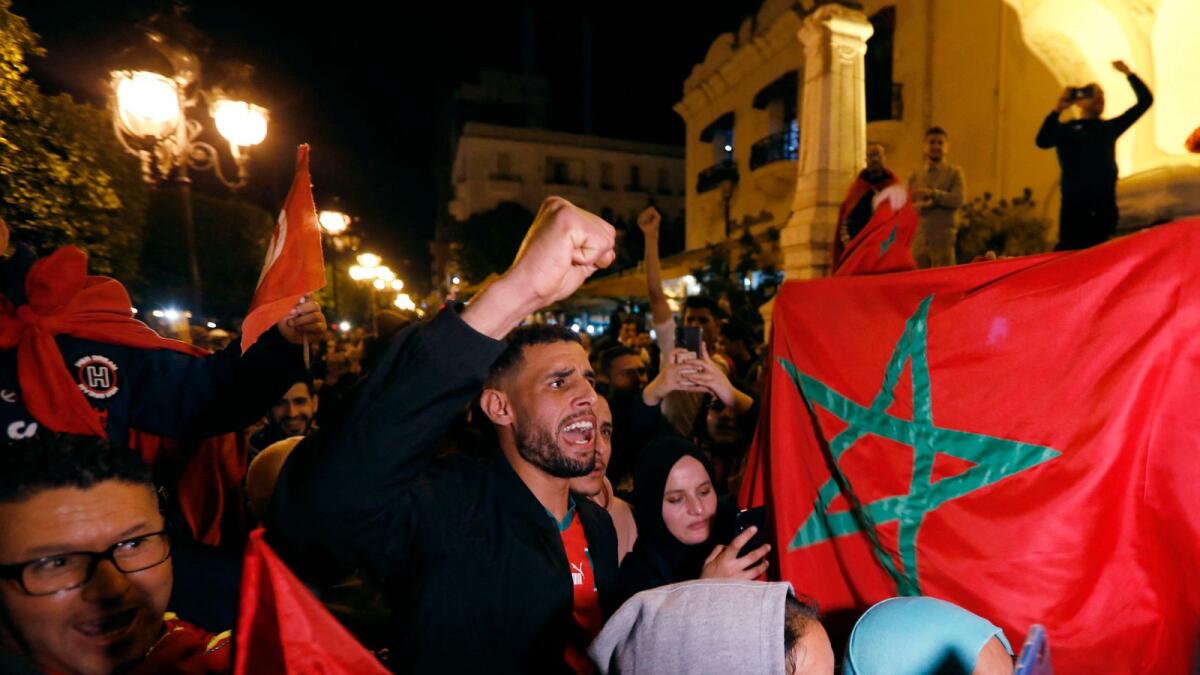 Morocco fans celebrate in Tunis after the match. — Reuters