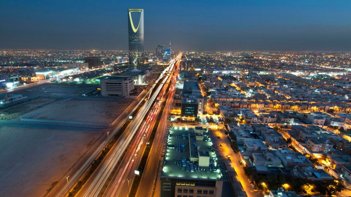The Kingdom Tower stands illuminated at night on King Fahad Road in Riyadh. Sukuk issuances in Saudi Arabia coupled with bond issuances in the UAE during the second half of 2023 and pushed aggregate issuances in the GCC to over $100 billion  at $107.8 billion  by mid-December-2023. — File photo