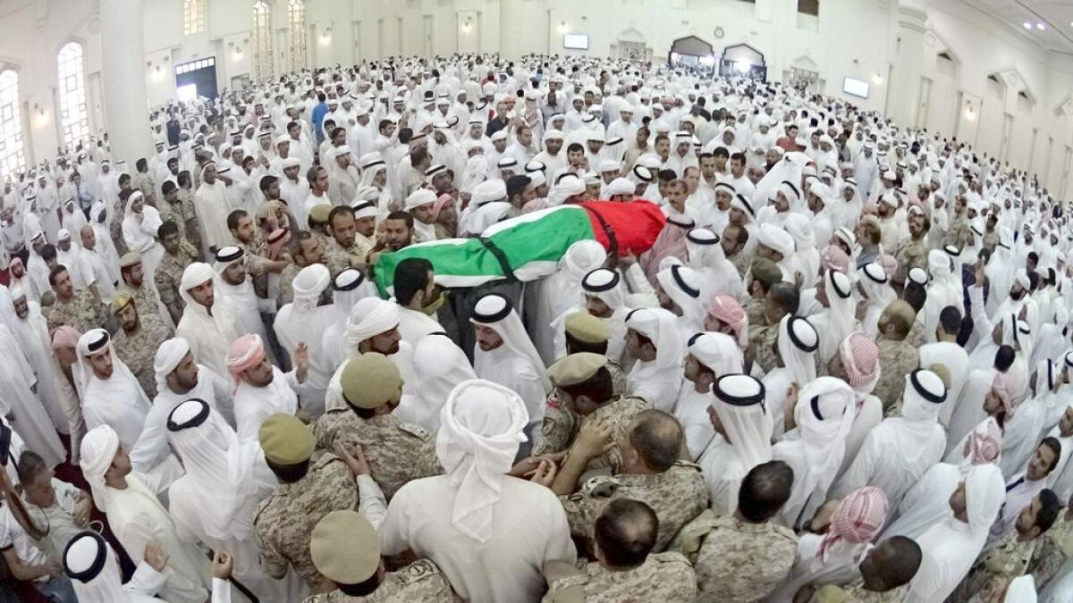 UAE soldiers and relatives carry the body of martyr Abdullah Ali Hassa Al Hamadi at the Shaikh Zayed Mosque in Ajman for funeral prayers. 