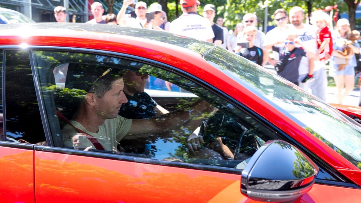 Robert Lewandowski leaves the FC Bayern Munich training ground in his car on Saturday. — AP