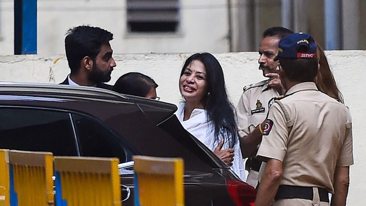 Former media executive Indrani Mukerjea is greeted by a friend after leaving the Byculla jail in Mumbai. -AFP