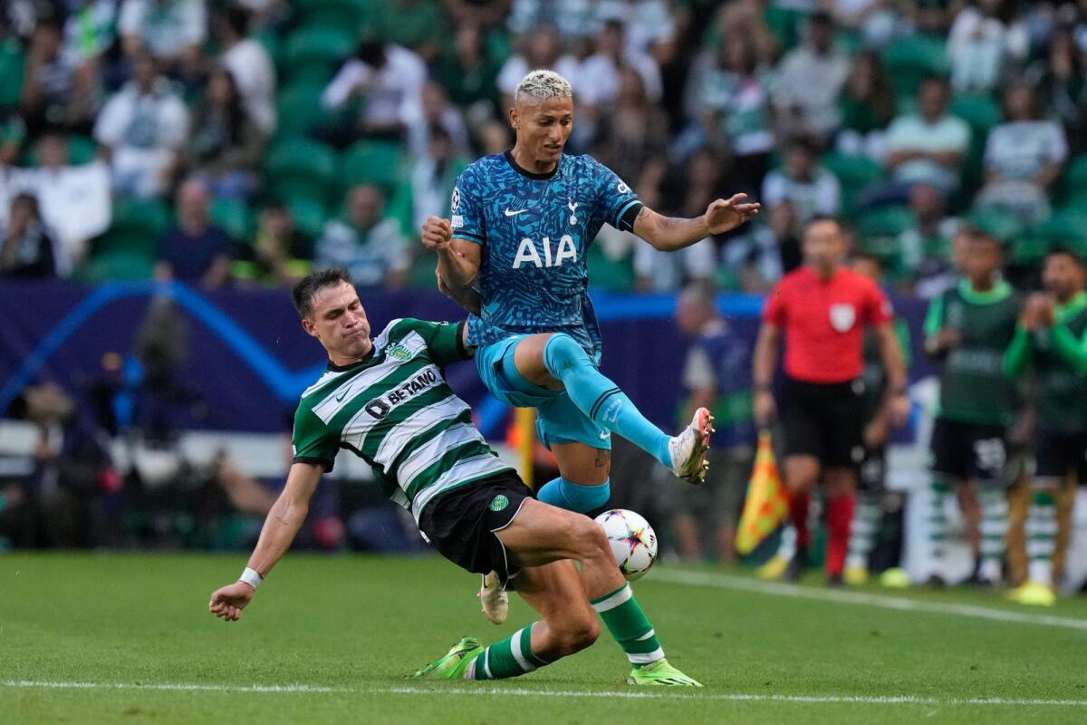 Sporting's Manuel Ugarte (left) challenges for the ball with Tottenham's Richarlison. — AP