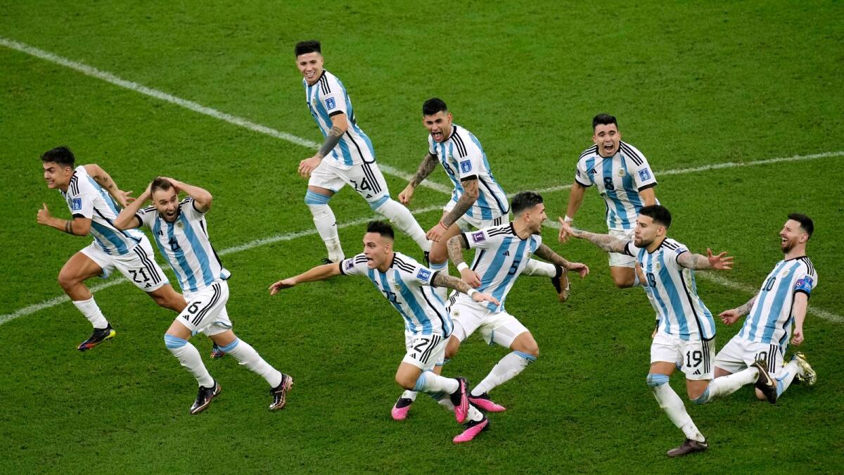Argentina's players celebrate their victory at the end of the World Cup final match. - AP