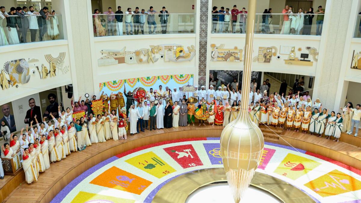 Staff on traditional Kerala attire with officials during the Onam celebrations at Burjeel.