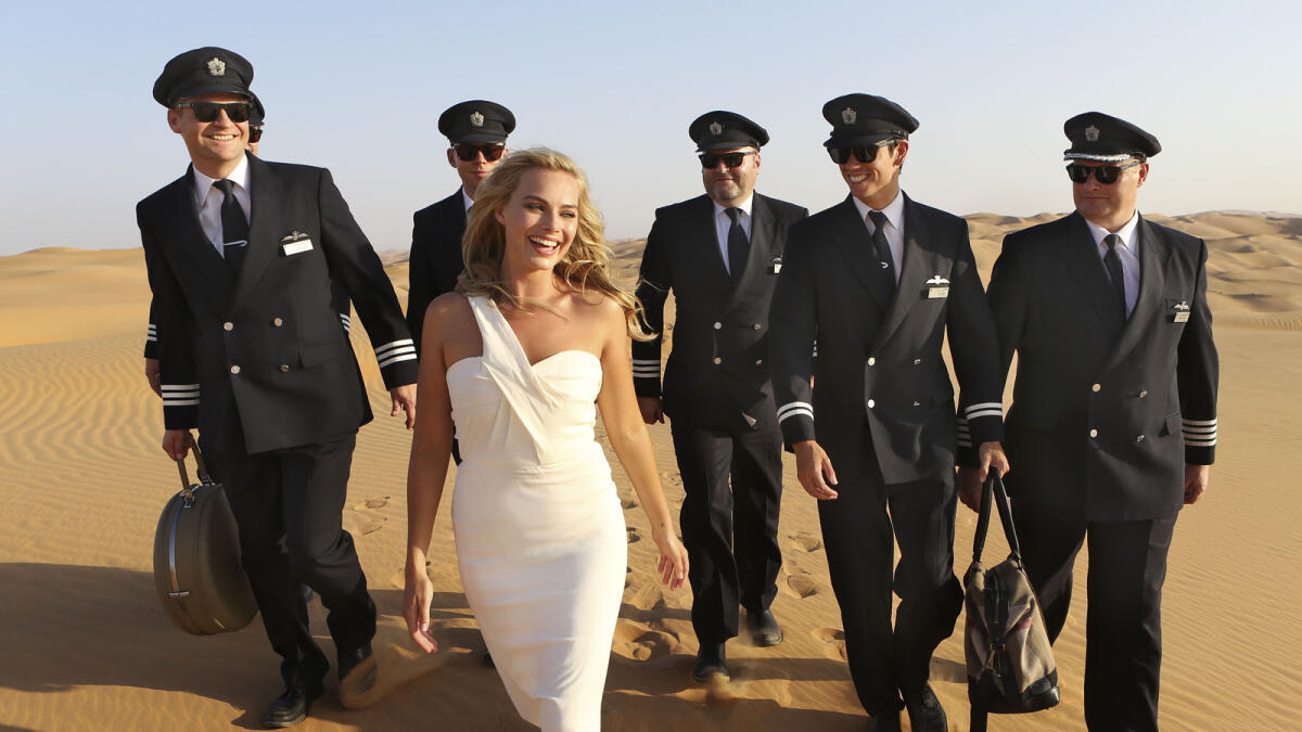 Margot Robbie evokes 50s glamour in Abu Dhabi desert
