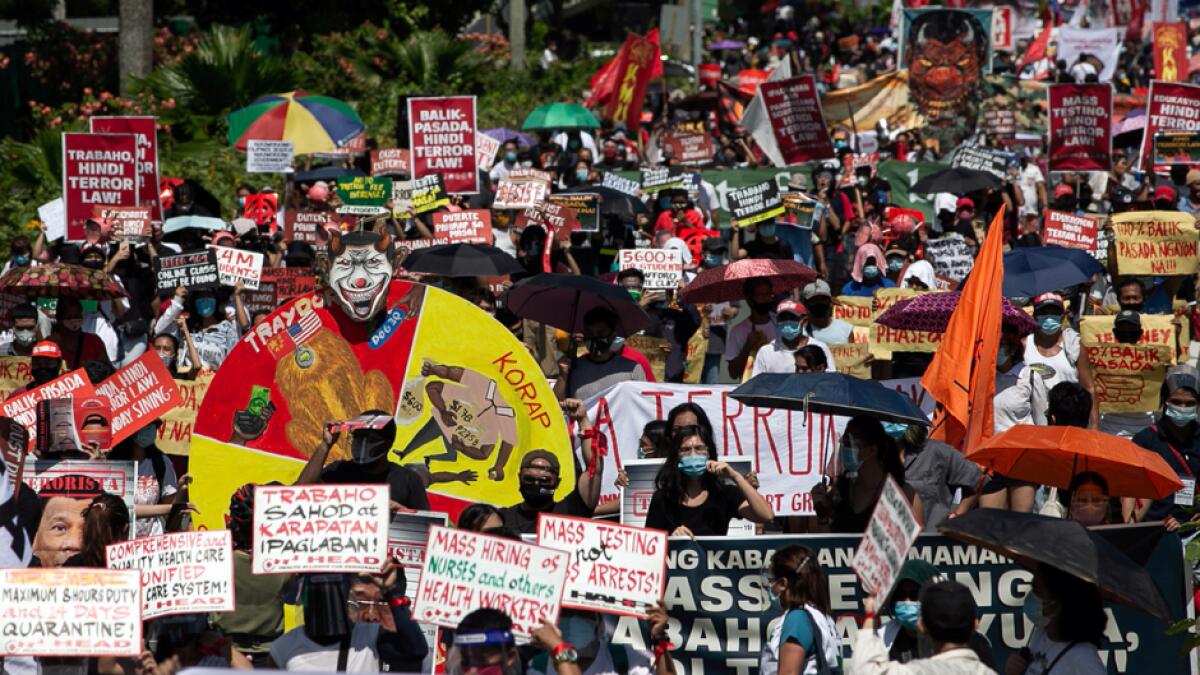 Filipinos gather for a protest ahead of Philippine President Rodrigo Duterte's fifth State of the Nation Address (SONA), in University Avenue, Quezon City, Metro Manila, Philippines. Photo: Reuters