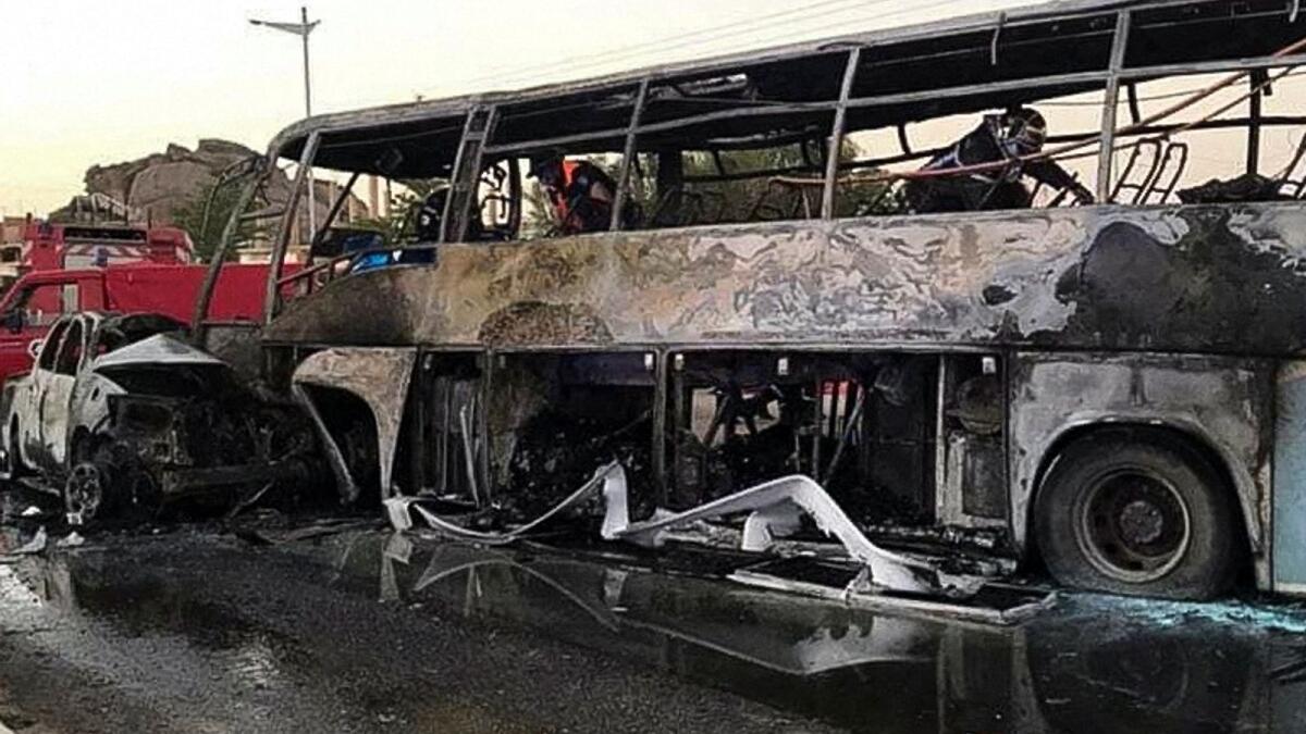 A view of a burnt bus and vehicle at the site of a road crash, in the city of Tamanrasset, Algeria in this handout picture obtained by Reuters on July 19.