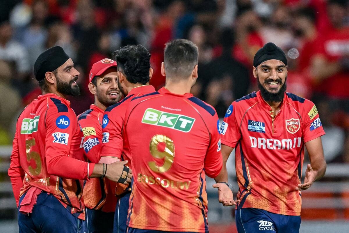 Punjab Kings players celebrate a wicket. — AFP