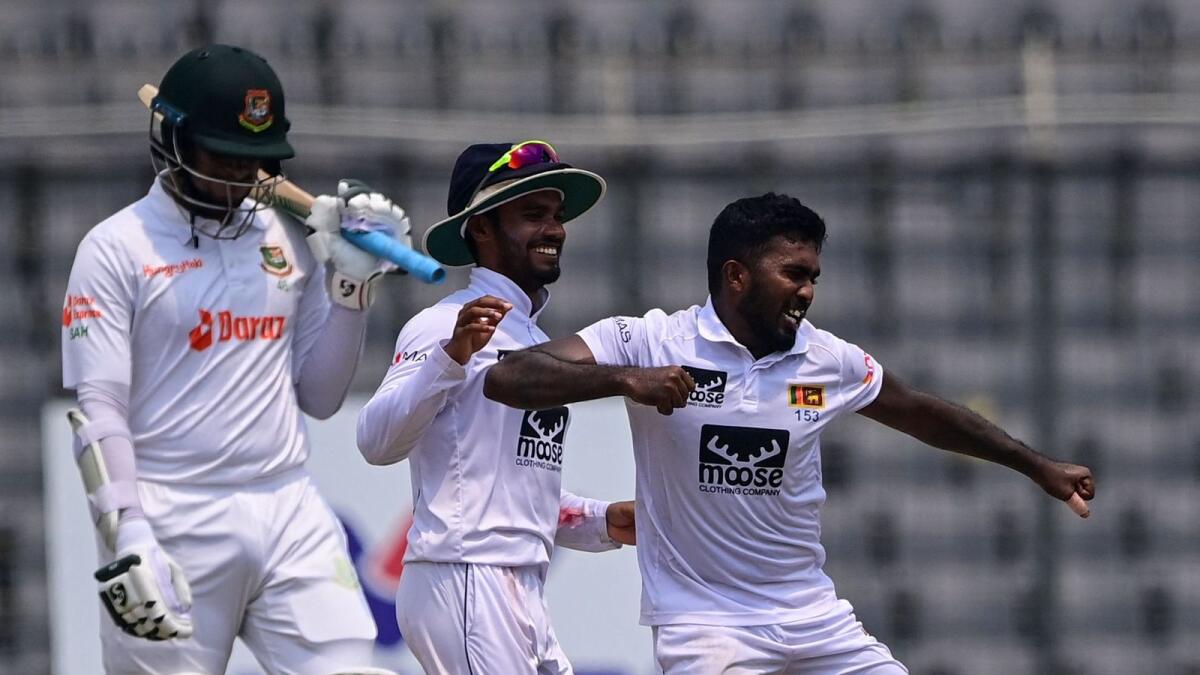 Sri Lanka's Asitha Fernando (right) celebrates after dismissing Bangladesh's Shakib Al Hasan (left) during the final day of the second Test on Friday. — AFP
