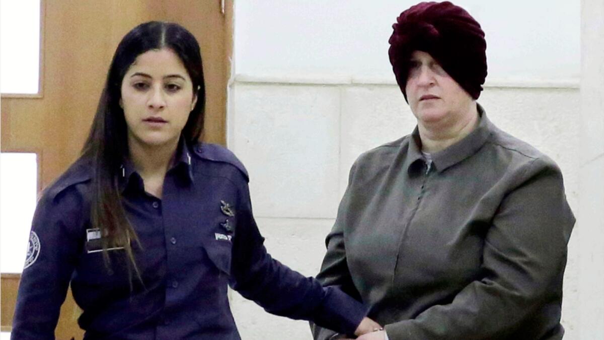 Malka Leifer, right, is brought to a courtroom in Jerusalem in 2018. — AP