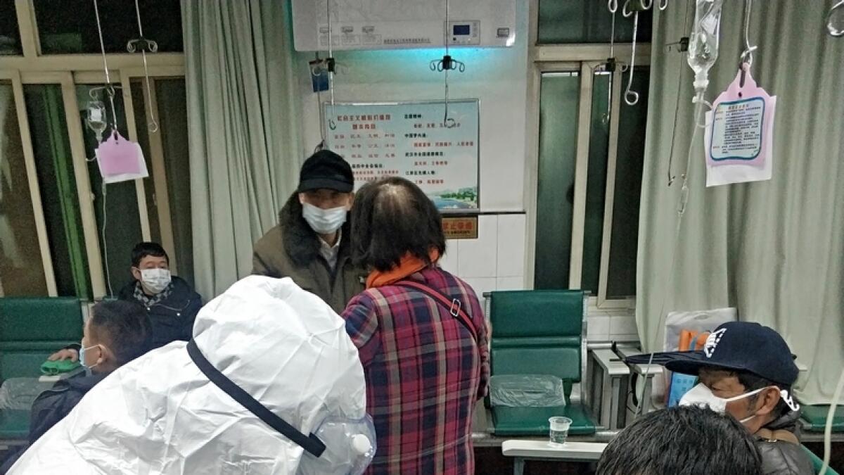 At one Wuhan hospital AFP visited, there were long queues of sick patients, many coughing, with overwhelmed staff unable to process them quickly.