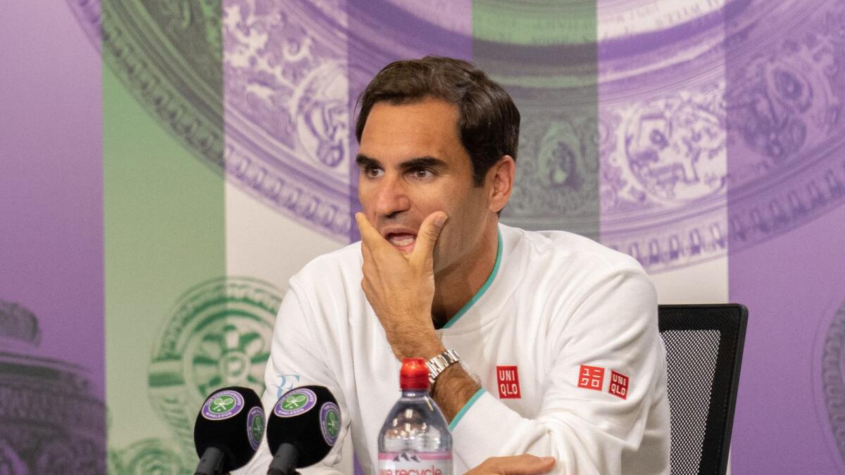 Roger Federer attends a press conference after losing to Hubert Hurkacz in the quarterfinal match at Wimbledon. (AFP)