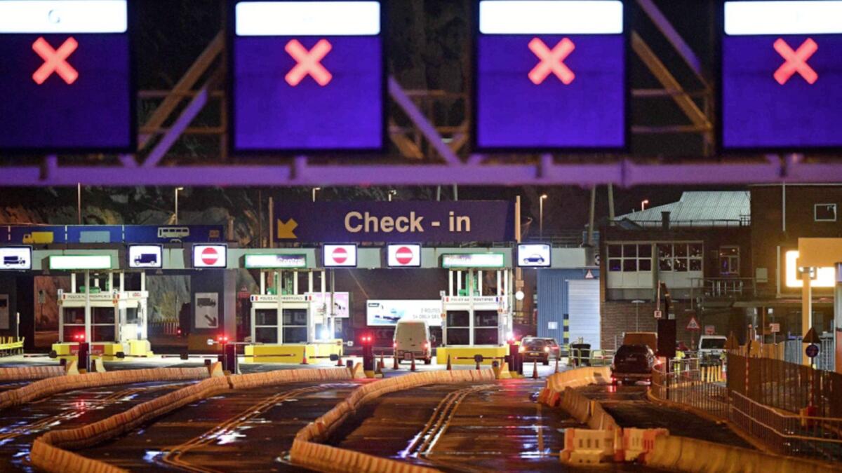Vehicles start to pass through the check-in booths at the ferry terminal at the Port of Dover, south east England after the Covid-19 testing of drivers queueing to depart for Europe got underway. France and Britain reopened cross-Channel travel on Wednesday after a 48-hour ban. — AFP