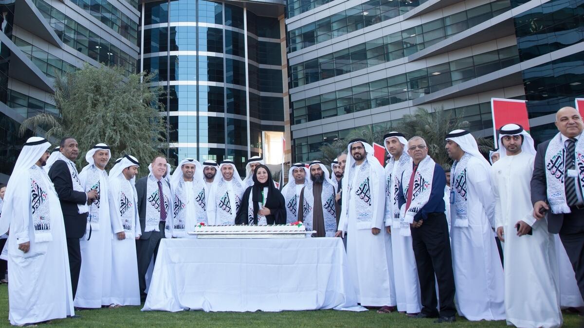 Officials and staff of the Dubai Silicon Oasis Authority celebrating the UAE's National Day.
