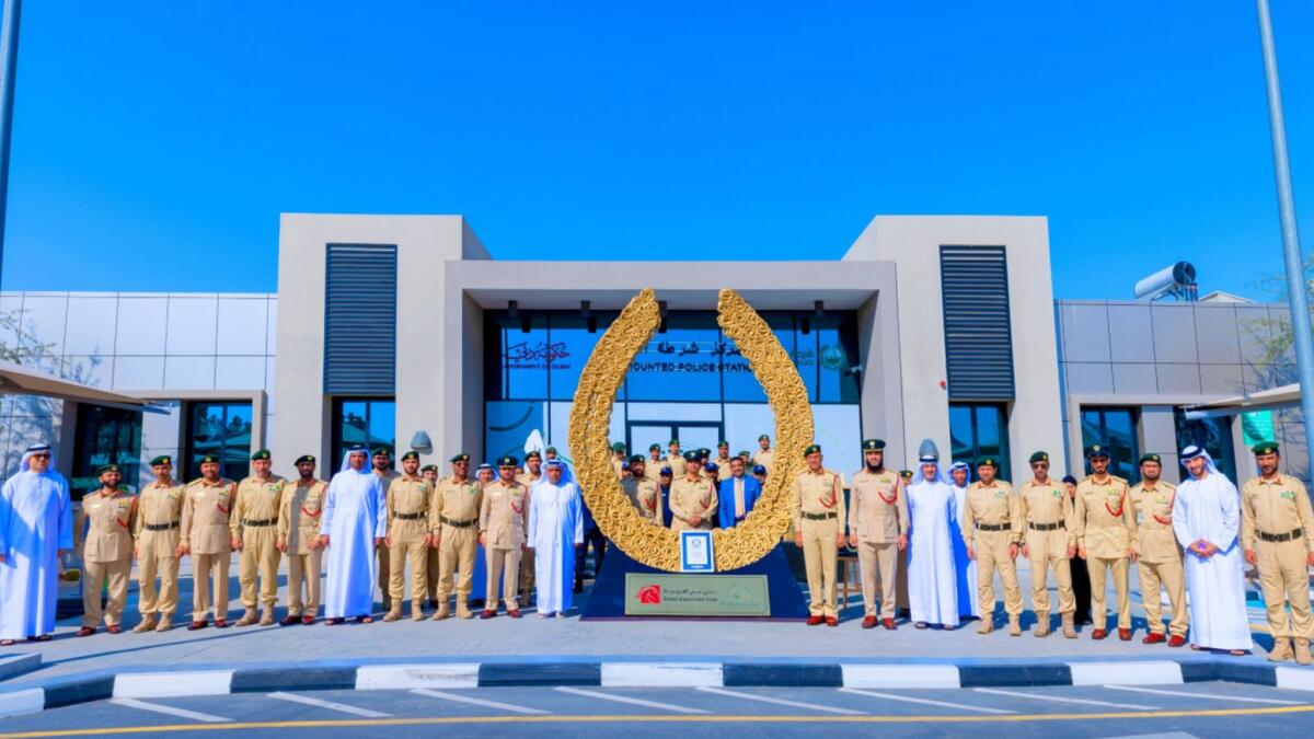 Dubai Police officers with the record-breaking Golden Horseshoe. — Supplied photo