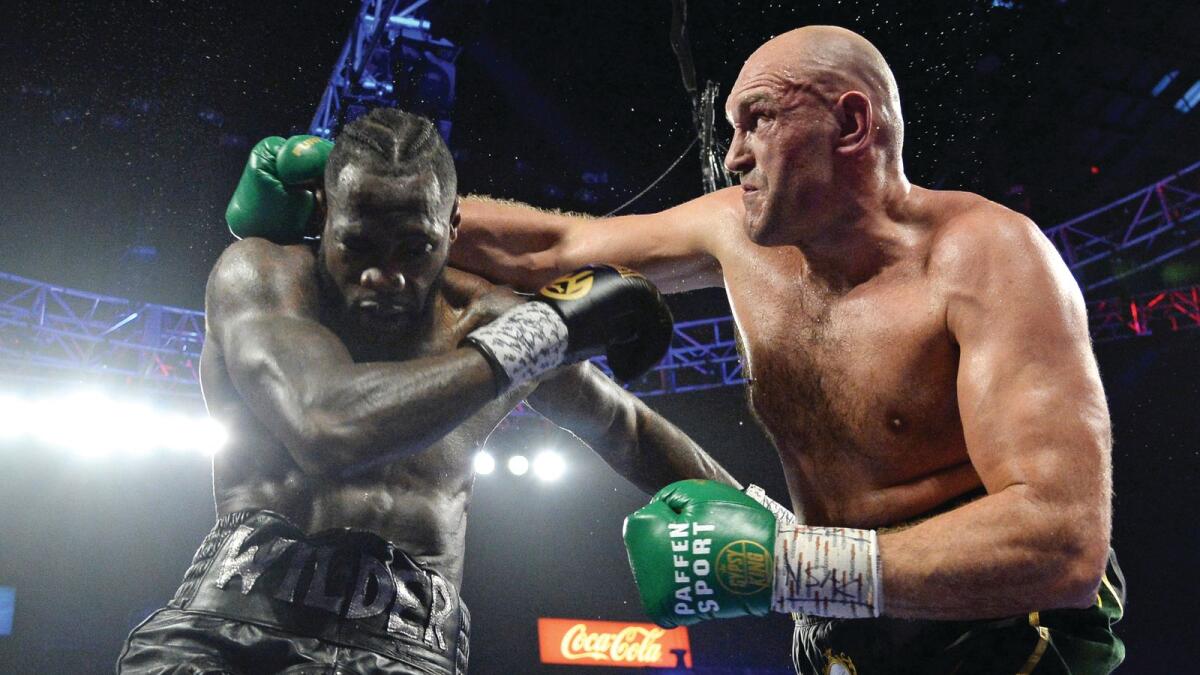Tyson Fury (right) during his WBC heavyweight title bout against Deontay Wilder at the MGM Grand Garden Arena. — Reuters