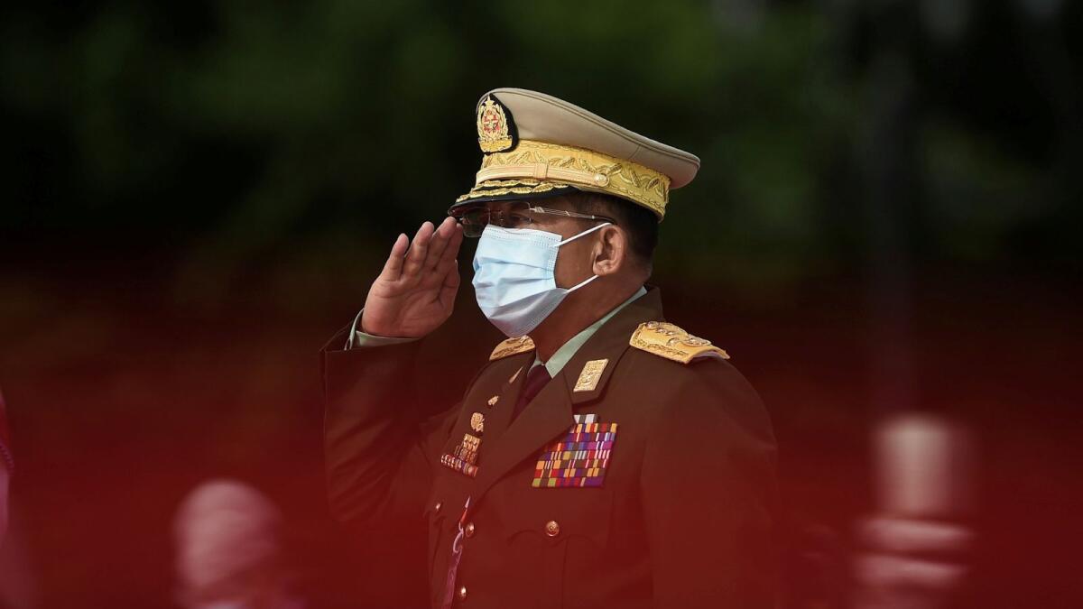 Myanmar's Army Chief Min Aung Hlaing salutes during the Martyrs' Day ceremony in Yangon.