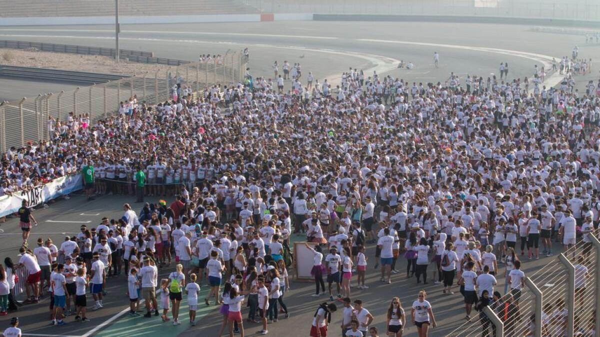 Huge crowds participate in the Color Run. -Photo by Leslie Pableo/Khaleej Times