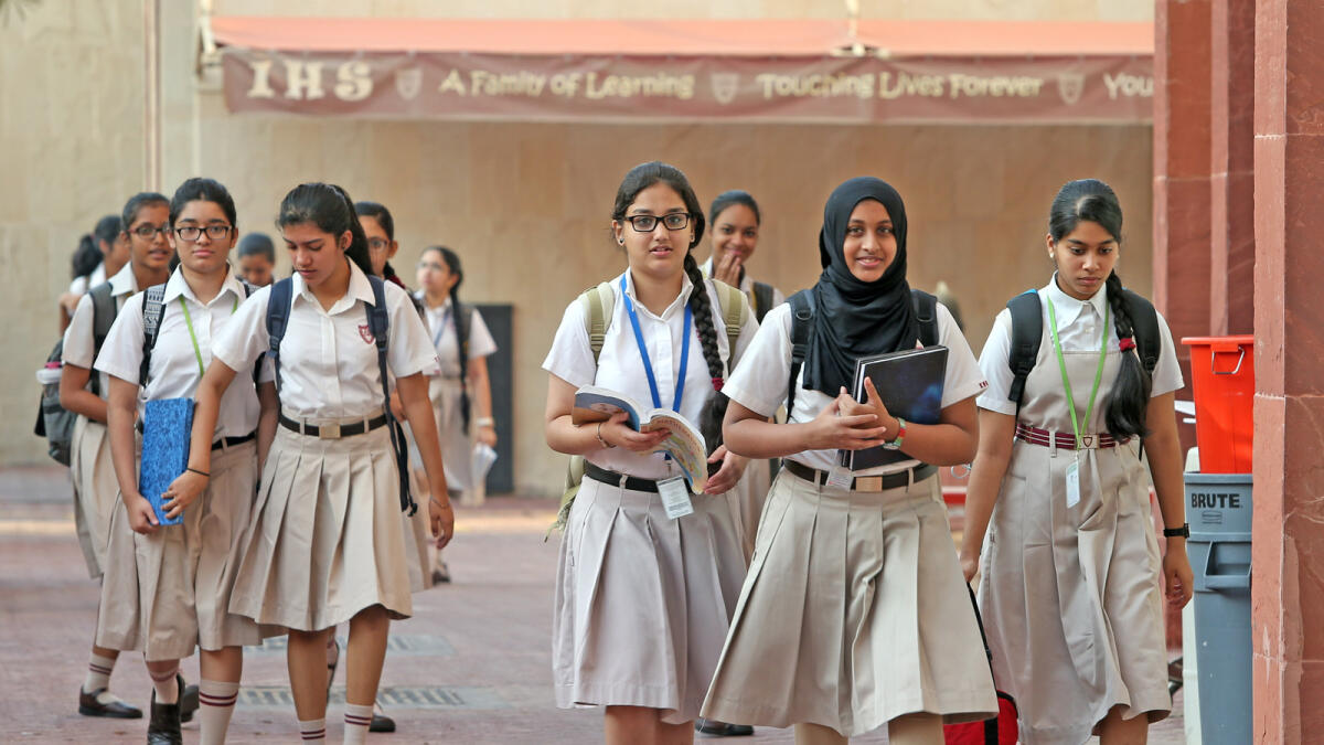 Students arrive at the Indian High School, Dubai, on their first day after the summer break. Dhes Handumon/KT Photographer