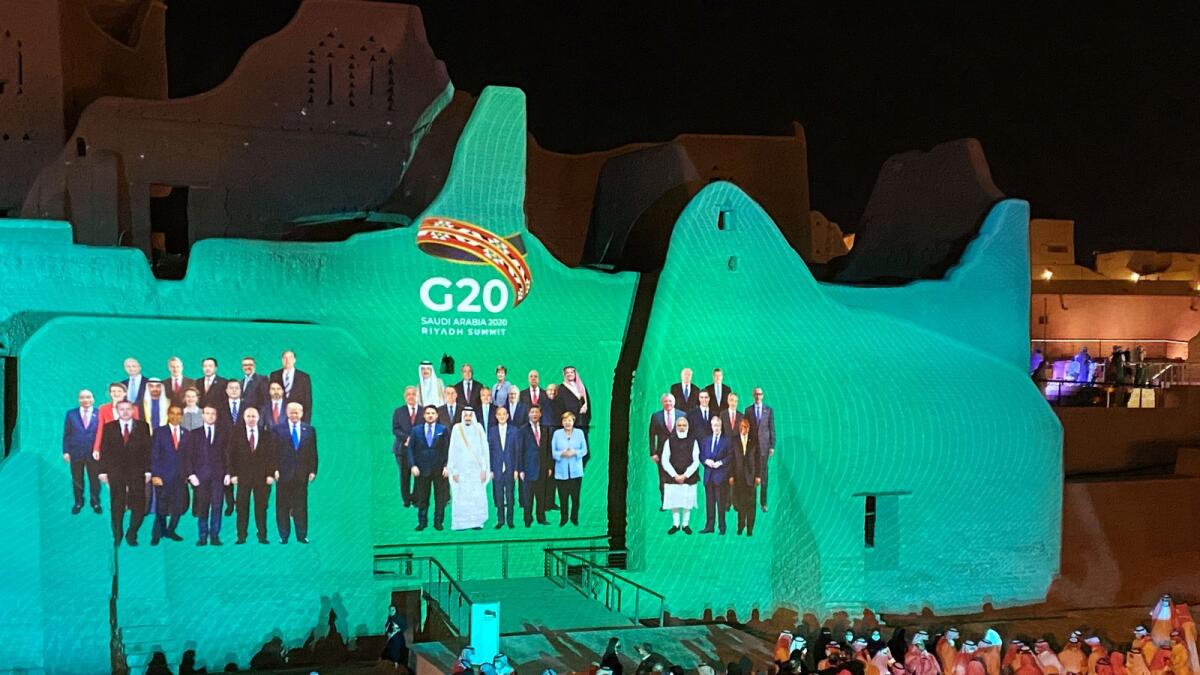 'Family Photo' for annual G20 Summit World Leaders is projected onto Salwa Palace in Diriyah, Saudi Arabia, November 20, 2020. Reuters
