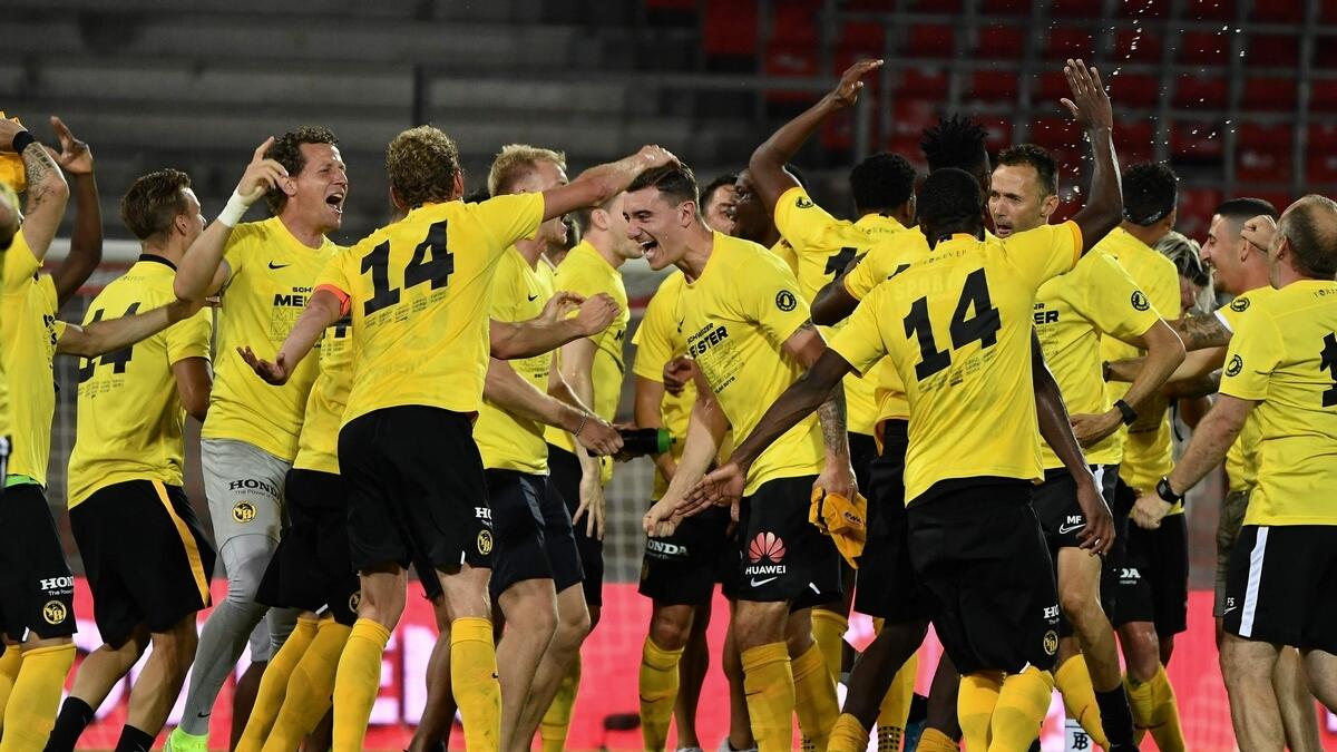 Young Boys' players celebrate after the club become Swiss Champion at the end of the Swiss Super League football match against FC Sion