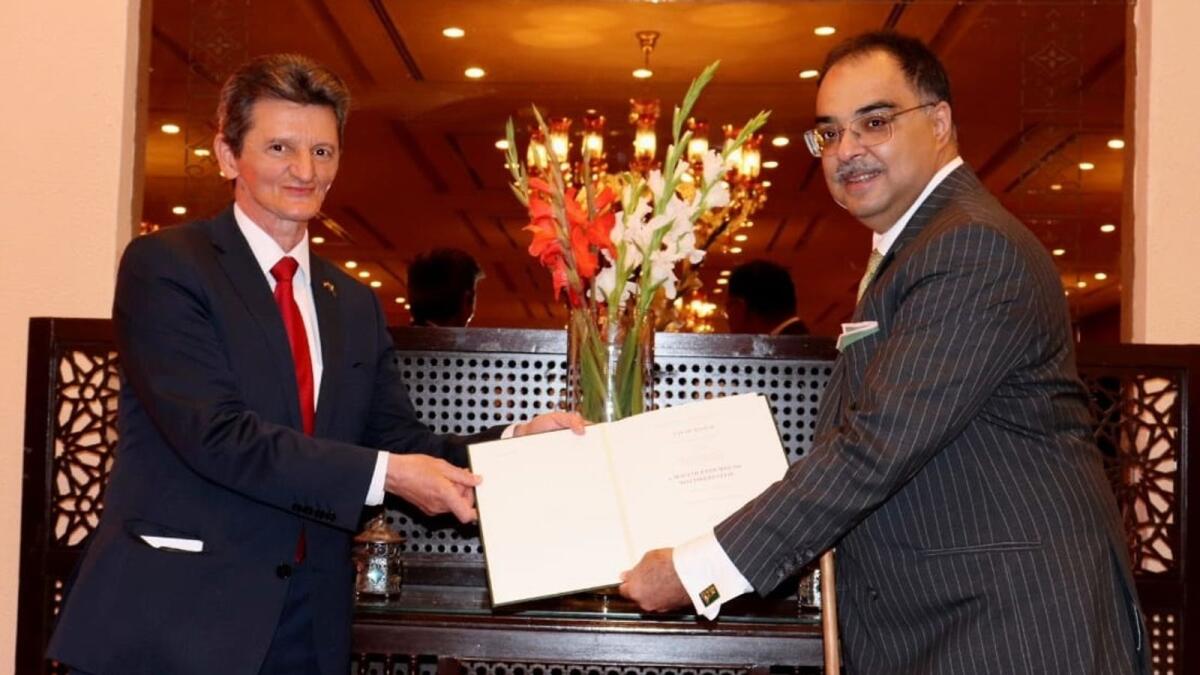 Zafar Masud receiving the award from Hungarian Ambassador to Pakistan Bela Fazekash. — Supplied photo